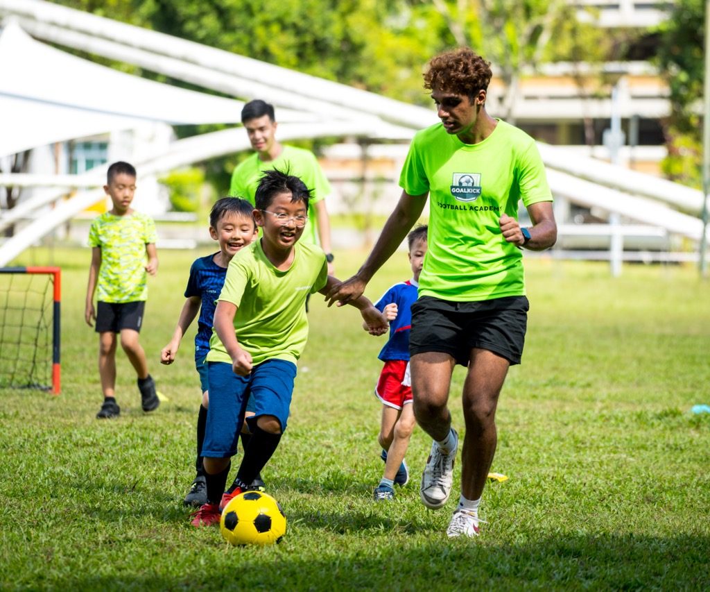 kids and football coach during a football match