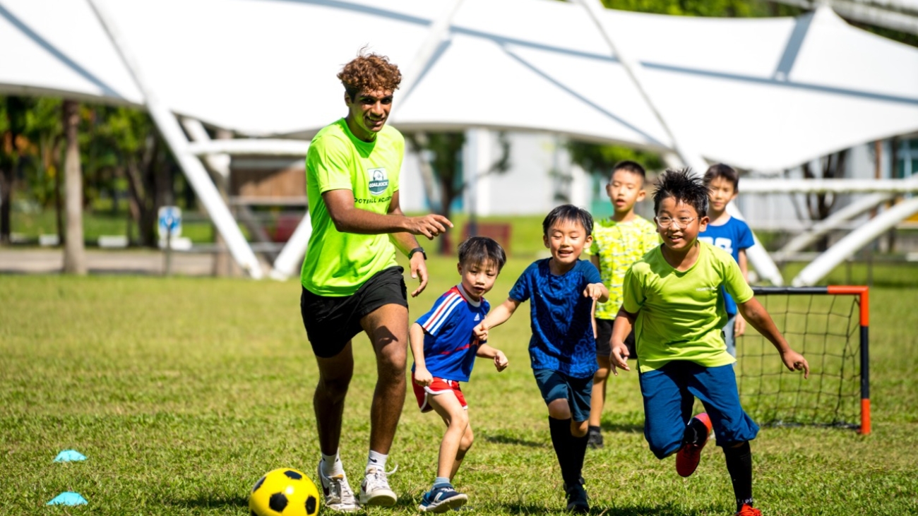 kids and football coach during a football match